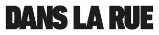 Black bold capital letters spelling "DANS LA RUE" on a white background.